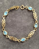 9ct Yellow Gold Celtic Bracelet with 5 Bezel Set Blue Stones - 7"