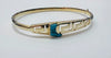 14CT GOLD BANGLE WITH BLUE STONE