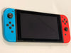 nintendo switch console red and blue joycons