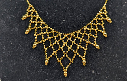 375 9K YELLOW GOLD HALL, BEAD CHAIN. WITH WEB DESIGN, 18