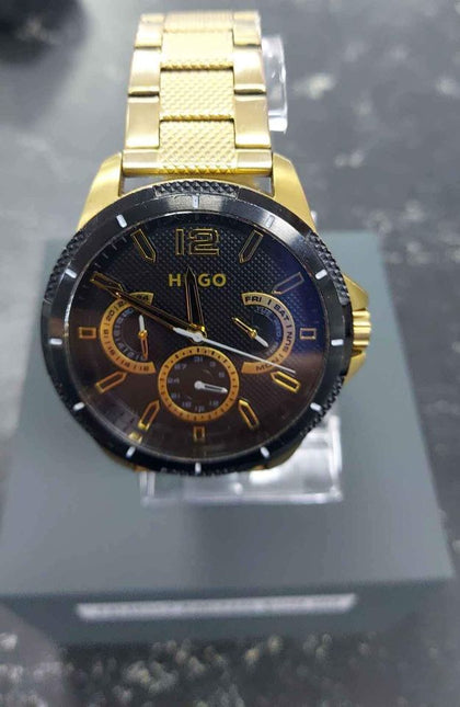 Hugo Gents Gold chrono .has some wear and tear on it.