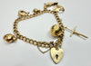 9ct yellow gold charm bracelet with heart shaped padlock clasp and safety chain 8"
