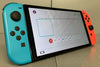 Nintendo Switch – OLED Model (Neon Blue/Neon Red) ( Mario Kart 8 Deluxe Not Included )