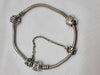 Pandora Bracelet with 2 charms (one heart) and safety chain