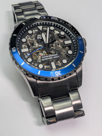 FOSSIL SKELETON WATCH WITH TIN PRESTON STORE