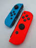 Nintendo Switch 32GB handheld gaming console with red/blue joy-cons, original charger and dock UNBOXED