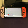 Nintendo Switch OLED - Red and Pastille pink Joy-Con