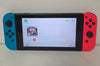 Nintendo Switch Console, 32GB + Neon Red/Blue with 1 boxed & 1 Unboxed game