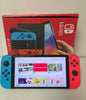 Nintendo Switch OLED Console with 2 games
