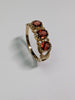 9CT GOLD RING WITH RED STONES SIZE O 1/2
