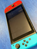 nintendo switch console red and blue joycons
