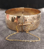 HENRY GRIFFITHS & SONS 9ct GOLD METAL CORE BANGLE WITH SAFETY CHAIN 50.4G