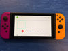 nintendo switch console purple and orange joycons