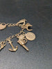 9ct Yellow Gold Charm Bracelet With 14x Charms - 16.19 Grams