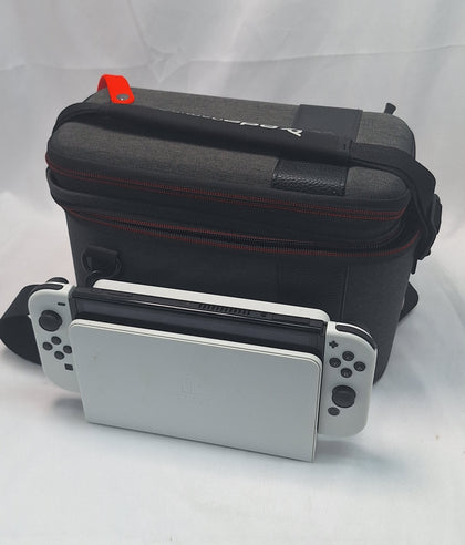 Nintendo Switch OLED White handheld 64GB console with dock grips and original charger in Nintendo carry case