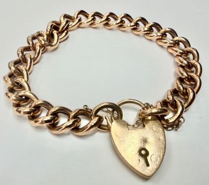 9ct rose gold curb chain bracelet with heart shaped padlock and safety chain 8
