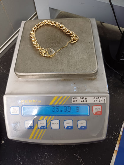 9ct Gold Belcher bracelet with safety chain and padlock 35.89g.