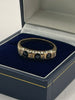 9ct Gold Ring With Black Stones - Q