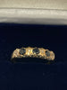 9ct Gold Ring With Black Stones - Q