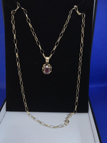 Hallmarked 375 and tested 9K , 6.4 grams gold link chain , Red stone  . 22