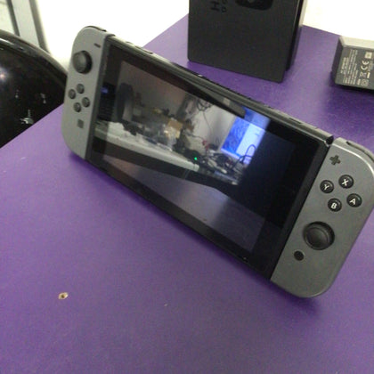 Nintendo Switch with dock and cables.