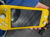 Switch Lite Yellow + Official Charger