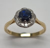 18ct Gold Sapphire & 0.22ct Diamond Cluster Head Ring - Size O (Valued at £1250)