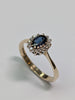9ct gold diamond ring with blue centre stone