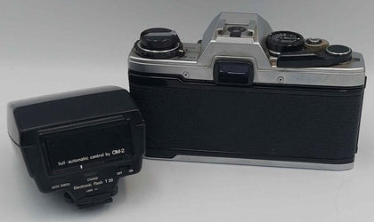 Vintage olympus OM10 35mm SLR film camera with flash attachment and travel cases