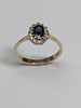9ct gold diamond ring with blue centre stone