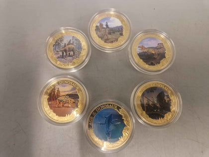 18x Age of the Dinosaurs coins. 24 carat gold plated copper, certificates of authenticity and protective sleeves included