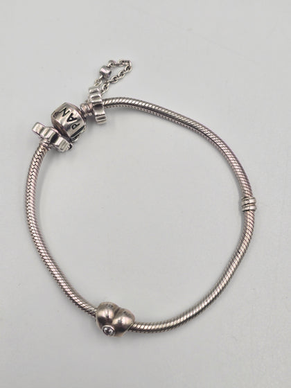 Pandora bracelet with flowered safety chain and heart charm