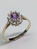 9ct gold ring with purple centre stone
