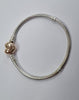 Pandora bracelet with gold heart clasp 17cm