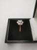 9CT Gold Daisy Cluster Ring, Cubic Zirconia Stones. 2.4Grams, Size: O - Boxed