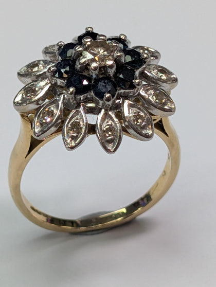 18CT GOLD DIAMOND FLOWER RING WITH BLACK STONES