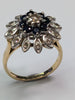 18CT GOLD DIAMOND FLOWER RING WITH BLACK STONES
