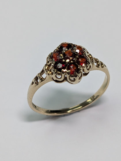 9CT GOLD RING  WITH DARK RED STONES