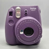 Fujifilm Instax Mini 9 Instant Camera Purple Battery operated and has no photo carts but has been tested and fully works