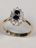 9ct gold ring with black stones
