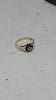 9ct Yellow Gold Ladies Ring With Clear Stone (Not Dia) Surrounded By Black Stones - Size O - 2 Grams