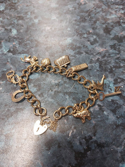 9CT CHARM BRACELET 25.24G 7.50 INCH