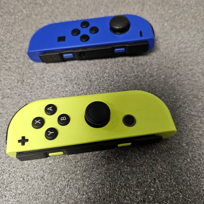 Nintendo Switch Joycons Blue (left) & Neon Yellow (Right)