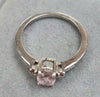 9ct White Gold Ring with Subtle Pink Stone size "O"