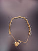 12.8G 9 CT Yellow gold curb bracelet with a heart padlock clasp & safety chain
