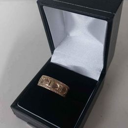 9CT Yellow Gold Band Ring With Patterns - Size S - 3.21 Grams.