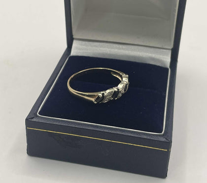 9ct gold ring with clear and black stones
