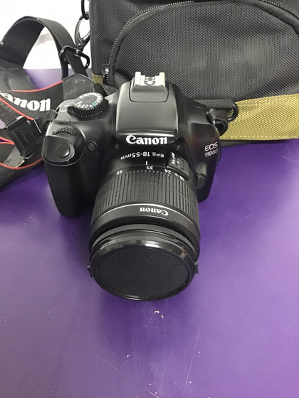 Canon EOS 1100D with lens, filter, batteries, charger and bag.
