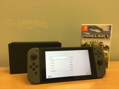 Nintendo Switch with Grey Joy-Cons Dock and Minecraft.