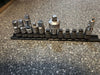 Snap on 1/4" drive swivel sockets and extension adapters with metal rack